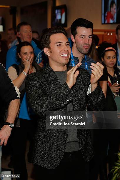 Olympian Apolo Ohno cheers the American Speed Skaters during his visit the USA House in the Olympic Village on February 22, 2014 in Sochi, Russia.