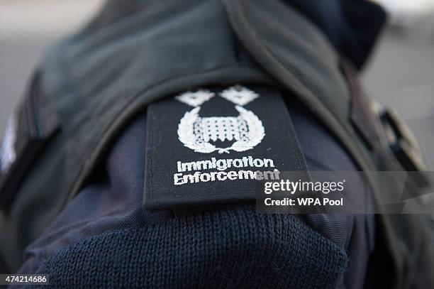 Immigration enforcement officers raid a home in Southall on May 21, 2015 in London, England. Despite pledging in 2010 to reduce migration numbers to...