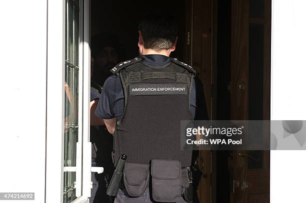 Immigration enforcement officers raid a home in Southall on May 21, 2015 in London, England. Despite pledging in 2010 to reduce migration numbers to...