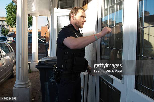 Immigration enforcement officers raid a home in Southall on May 21, 2015 in London, England. Despite pledging in 2010 to reduce migration numbers to...