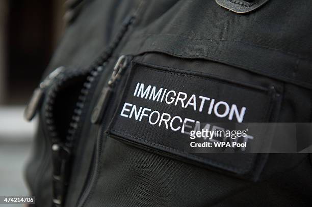 Immigration enforcement officers raid a home in Southall on May 21, 2015 in London, England. Despite pledging in 2010 to reduce migration numbers to...