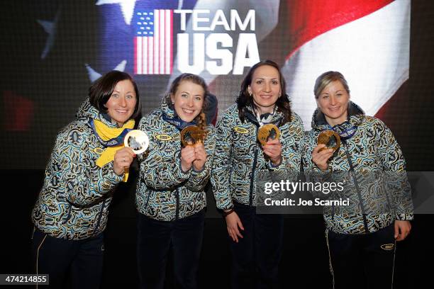 Ukraine Olympians Vita Semerenko, Juliya Dzhyma, Olena Pidhrushna and Valj Semerenko visit the USA House in the Olympic Village on February 22, 2014...