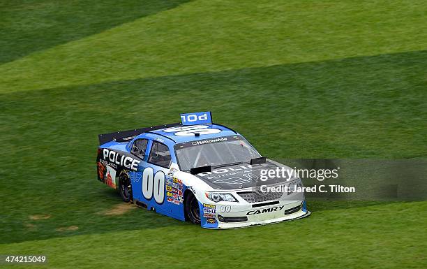 Jason White, driver of the Police Sunglasses/Friday Night Tykes Toyota, spins during the NASCAR Nationwide Series DRIVE4COPD 300 at Daytona...