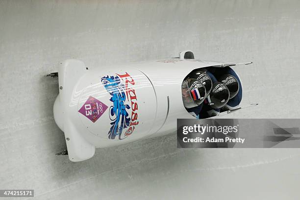 Pilot Alexander Zubkov, Alexey Negodaylo, Dmitry Trunenkov and Alexey Voevoda of Russia team 1 make a run during the Men's Four Man Bobsleigh heats...