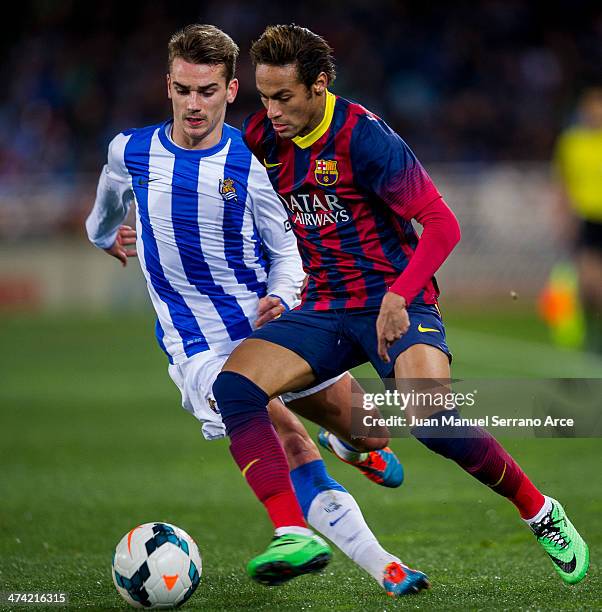 Neymarof FC Barcelona duels for the ball with Antoine Griezmann of Real Sociedad during the La Liga match between Real Sociedad and Barcelona at...