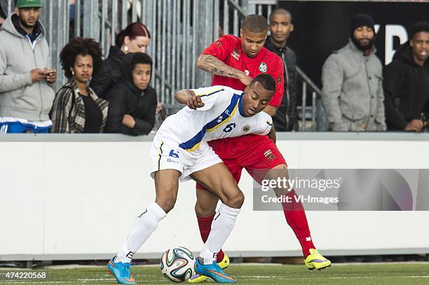 Jeremy de Nooijer of Curacao, Milano Koenders of Suriname during the International friendy match between Curacao and Suriname on May 20, 2015 at the...