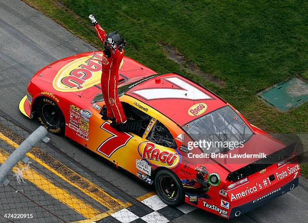 Regan Smith, driver of the Ragu Chevrolet, celebrates winning the NASCAR Nationwide Series DRIVE4COPD 300 at Daytona International Speedway on...