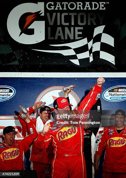 Regan Smith, driver of the Ragu Chevrolet, celebrates in Victory Lane after winning during the NASCAR Nationwide Series DRIVE4COPD 300 at Daytona...