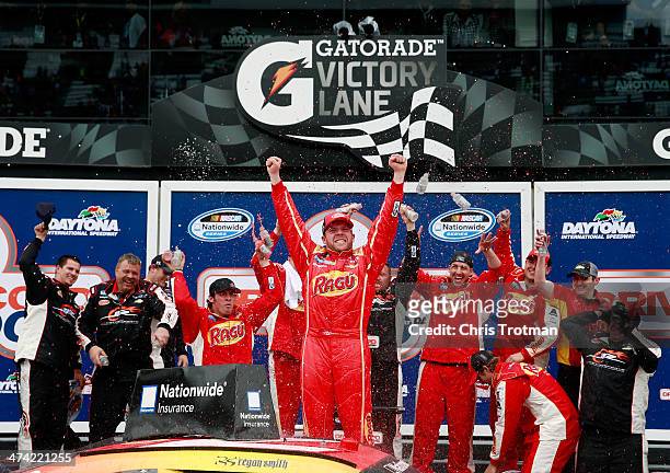 Regan Smith, driver of the Ragu Chevrolet, celebrates in Victory Lane after winning during the NASCAR Nationwide Series DRIVE4COPD 300 at Daytona...