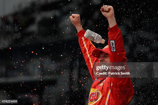 Regan Smith, driver of the Ragu Chevrolet, celebrates in Victory Lane after winning during the NASCAR Nationwide Series DRIVE4COPD 300 at Daytona...