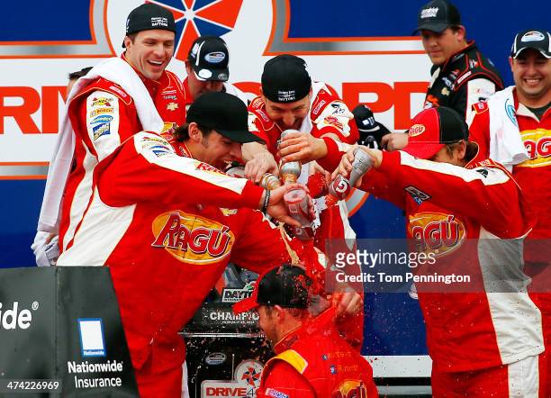 Regan Smith, driver of the Ragu Chevrolet, celebrates in Victory Lane after winning after winning the NASCAR Nationwide Series DRIVE4COPD 300 at...