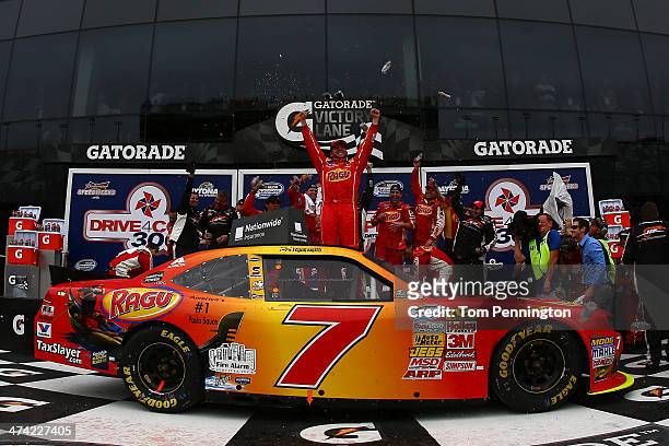 Regan Smith, driver of the Ragu Chevrolet, celebrates in Victory Lane after winning the NASCAR Nationwide Series DRIVE4COPD 300 at Daytona...
