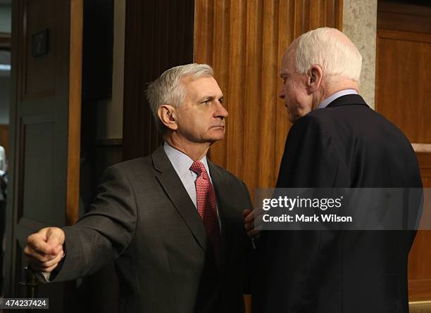 Sen. John McCain talks with Sen. Jack Reed during a Senate Armed Services Committee hearing on Capitol Hill May 21, 2015 in Washington, DC. The...