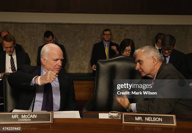 Sen. John McCain talks with Sen. Jack Reed during a Senate Armed Services Committee hearing on Capitol Hill May 21, 2015 in Washington, DC. The...