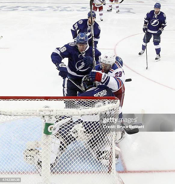 Dominic Moore of the New York Rangers crashes the net against the Tampa Bay Lightning in Game Three of the Eastern Conference Finals during the 2015...