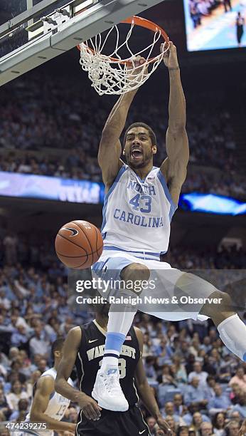 North Carolina's James Michael McAdoo dunks over Wake Forest's Aaron Rountree III during the second half on Saturday February 22 at the Smith Center...