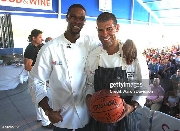 Players Chris Bosh and Shane Battier attend KitchenAid® Culinary Demonstrations during the Food Network South Beach Wine & Food Festival at Grand...