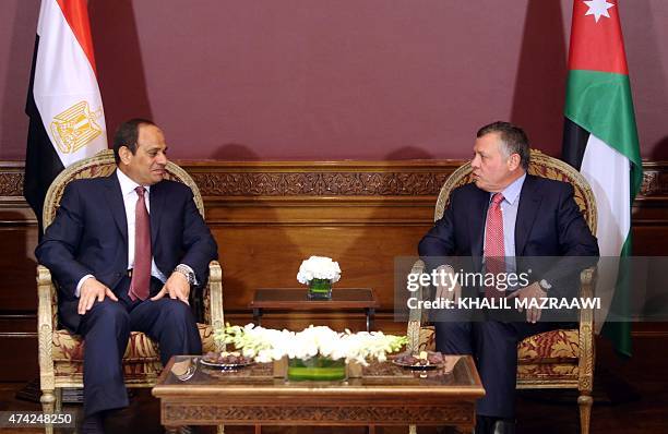 Jordan's King Abdullah II speaks with Egyptian President Abdel Fattah al-Sisi during a meeting in Amman following the latter's arrival for the...