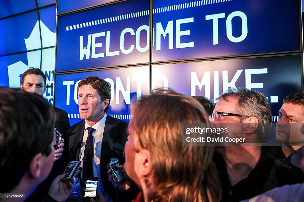 Mike Babcock scrums with the media after he was introduced to Toronto at a press conference