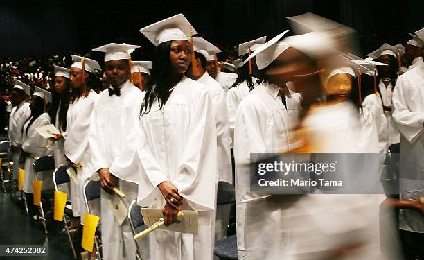 McDonogh Senior High School graduates stand at their commencement at the Ernest N. Morial Convention Center on May 14, 2015 in New Orleans,...