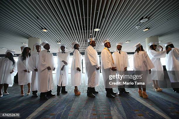 McDonogh Senior High School graduates stand at their commencement at the Ernest N. Morial Convention Center on May 14, 2015 in New Orleans,...