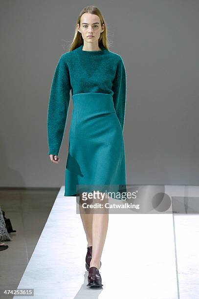 Model walks the runway at the Jil Sander Autumn Winter 2014 fashion show during Milan Fashion Week on February 22, 2014 in Milan, Italy.