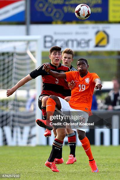 Stefano Russo of Germany challenges Daishawn Redan of Netherlands during the international friendly match between U15 Netherlands and U15 Germany at...