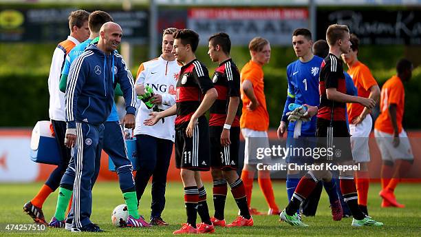 Head coach Andre Schubert of Germany celebrates with Nicolas Kuehn of Germany after the international friendly match between U15 Netherlands and U15...