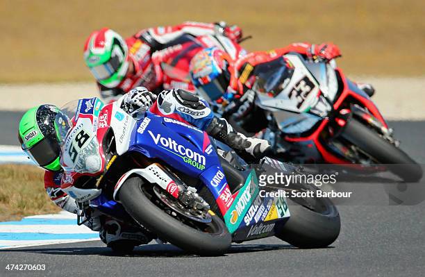 Eugene Laverty of Ireland and Voltcom Crescent Suzuki leads Marco Melandri of Italy and Aprilia Racing Team in race 1 during round one of the 2014...