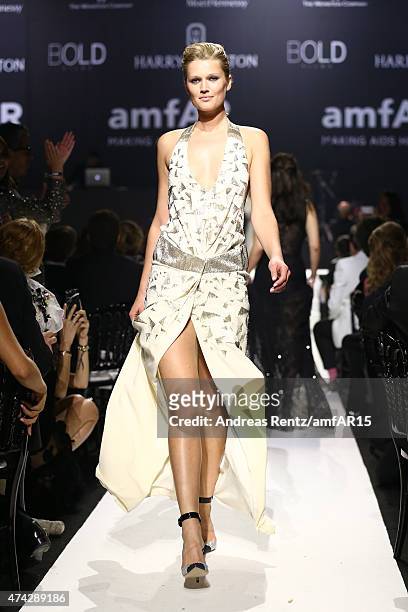 Model Toni Garrn walks during the fashion show runway during amfAR's 22nd Cinema Against AIDS Gala, Presented By Bold Films And Harry Winston at...