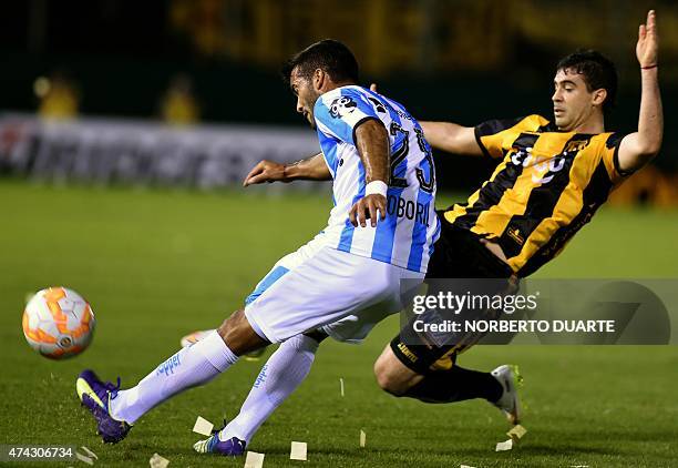 German Voboril of Argentina's Racing, vies for the ball with Julian Benitez, of Paraguay's Guarani, during their Libertadores Cup quarterfinal first...