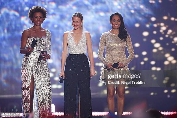 The hosts Mirjam Weichselbraun, Alice Tumler and Arabella Kiesbauer performs on stage during the second Semi Final of the Eurovision Song Contest...
