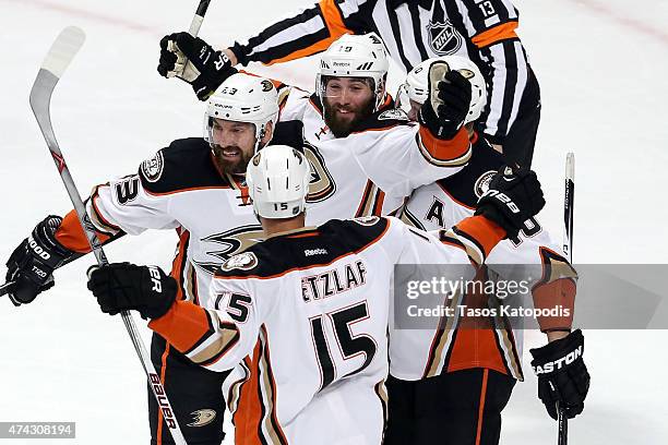 Patrick Maroon of the Anaheim Ducks celebrates with Francois Beauchemin and Ryan Getzlaf after scoring a first period goal against the Chicago...