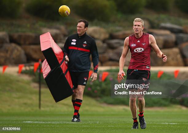 Dustin Fletcher of the Bombers kicks the ball during an Essendon Bombers AFL training session at True Vaule Solar Centre on May 22, 2015 in...