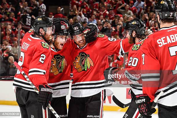 Patrick Kane of the Chicago Blackhawks celebrates with Duncan Keith, Brad Richards and Brandon Saad after scoring against the Anaheim Ducks in the...