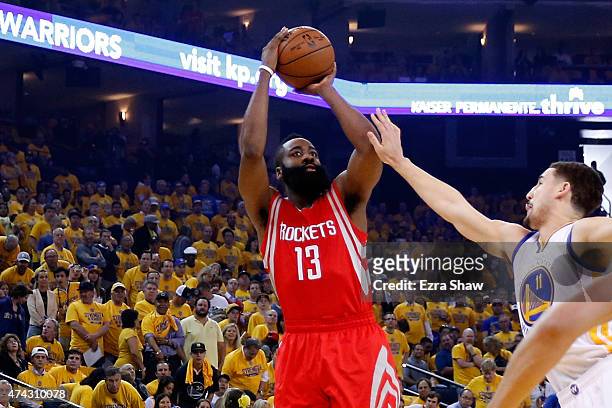 James Harden of the Houston Rockets shoots against Klay Thompson of the Golden State Warriors in the first quarter during game two of the Western...