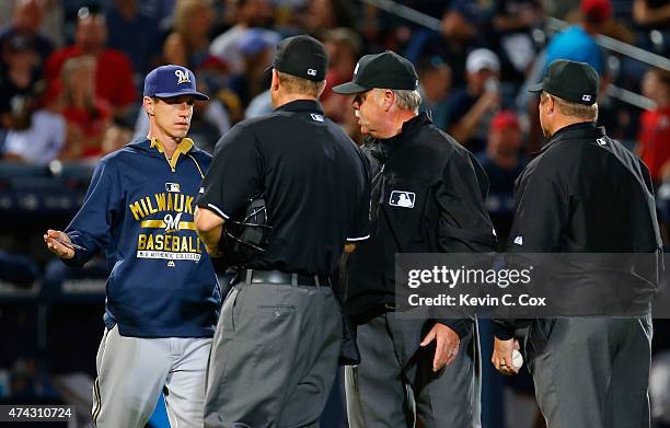Manager Craig Counsell of the Milwaukee Brewers questions the umpires after Will Smith was ejected in the seventh inning against the Atlanta Braves...