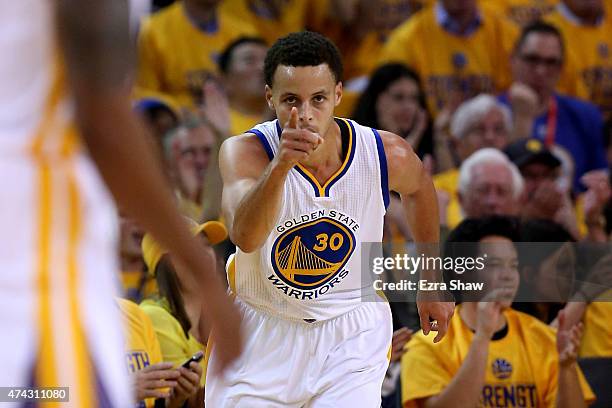 Stephen Curry of the Golden State Warriors reacts after a basket in the first quarter against the Houston Rockets during game two of the Western...