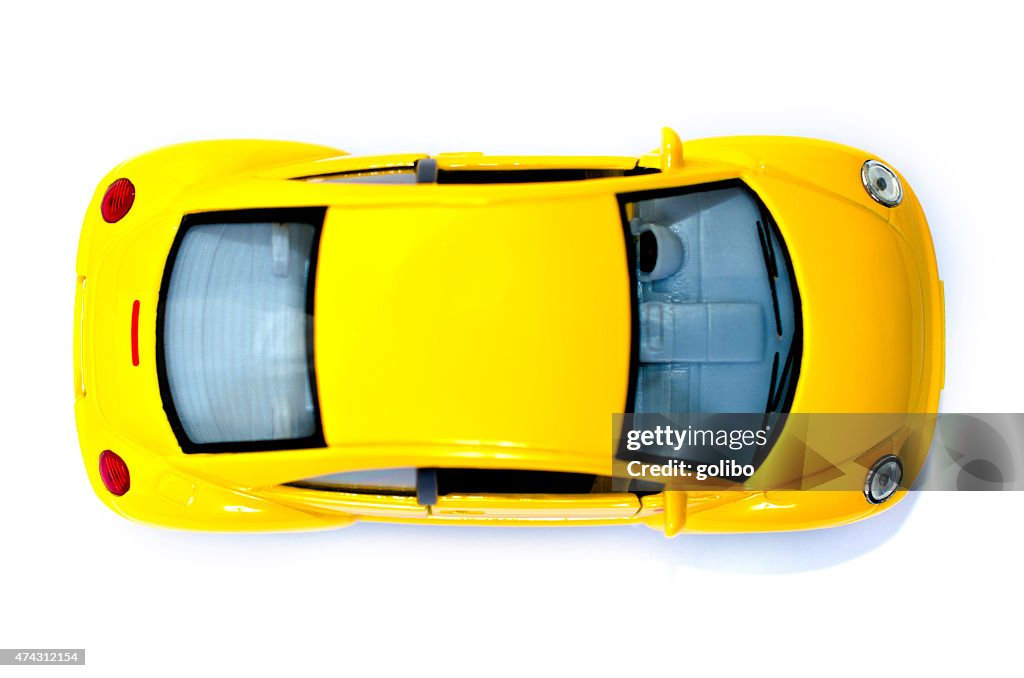 Yellow toy car from above