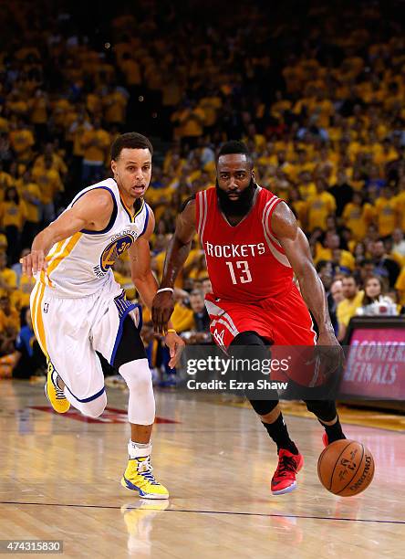James Harden of the Houston Rockets handles the ball against Stephen Curry of the Golden State Warriors in the second quarter during game two of the...