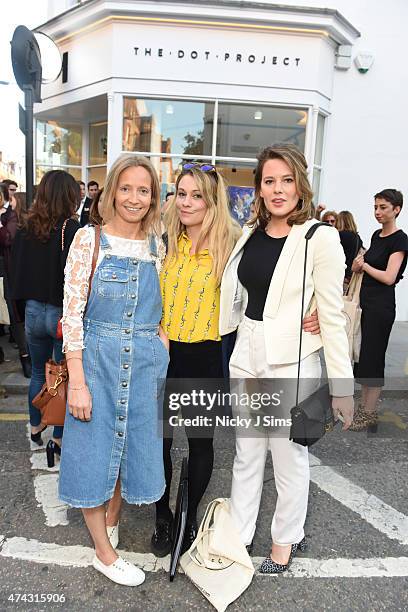 Martha Ward, Olivia Marquis, and Tarka Russell at the launch of The Dot Project group show 'Distorted Vision' on May 21, 2015 in London, England.