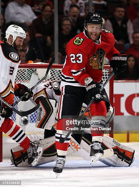 Kris Versteeg of the Chicago Blackhawks deflects the puck in front of Frederik Andersen of the Anaheim Ducks in the third period of Game Three of the...