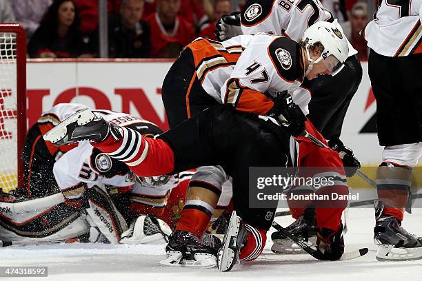 Hampus Lindholm of the Anaheim Ducks checks Jonathan Toews of the Chicago Blackhawks in the third period of Game Three of the Western Conference...