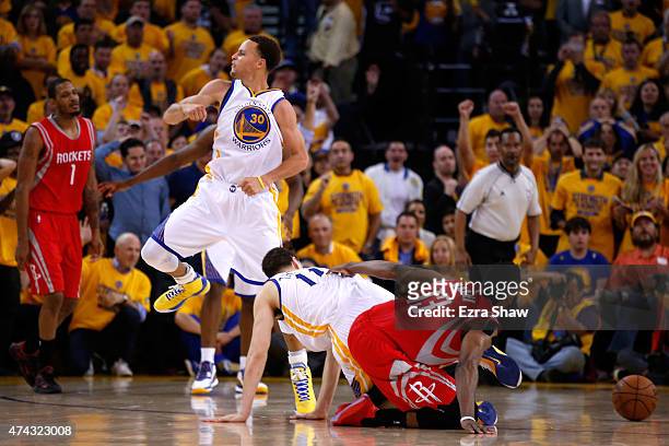 Stephen Curry of the Golden State Warriors reacts as James Harden of the Houston Rockets fails to hold on to the ball as time expires during game two...