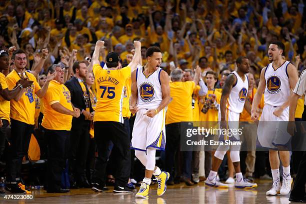 Stephen Curry and Klay Thompson of the Golden State Warriors react after defeating the Houston Rockets during game two of the Western Conference...