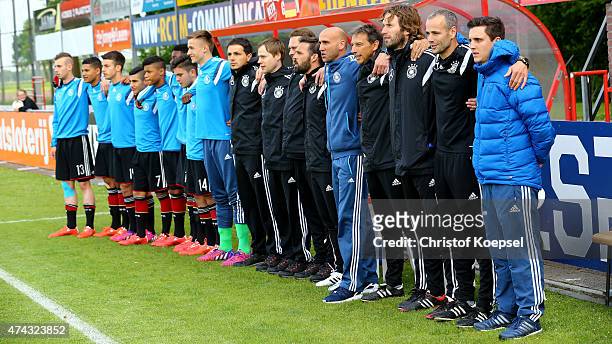 The substitute player and the coaches of Germany come together for the national anthem prior to the international friendly match between U15...