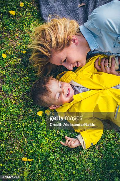 childhood - happy family grass stock pictures, royalty-free photos & images
