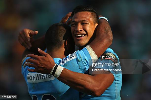 Israel Folau of the Waratahs celebrates scoring his third try during the round two Super Rugby match between the Waratahs and the Western Force at...