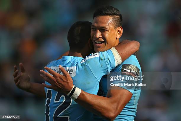 Israel Folau of the Waratahs celebrates scoring his third try during the round two Super Rugby match between the Waratahs and the Western Force at...