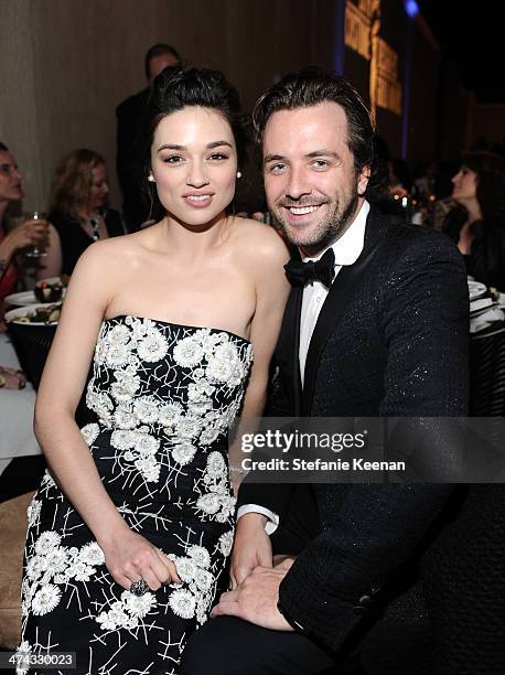 Actress Crystal Reed and TV host Darren McMullen attend the 16th Costume Designers Guild Awards with presenting sponsor Lacoste at The Beverly Hilton...